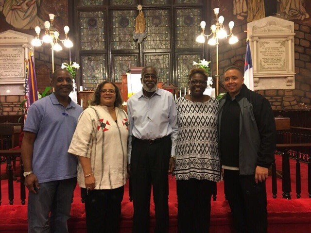 Four NYTS AME Alumni/ae stand with a congregant inside Mother of Emanuel African Methodist Episcopal Church.